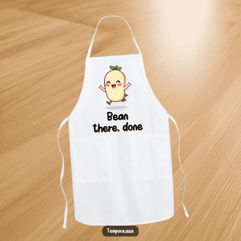 Funny edamame character doing a cheerful hop on a kitchen apron, bringing fun and humor to meal prep.
